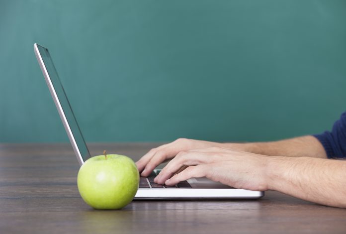 Person Using Laptop Besides Green Apple Какви устройства ще представи Apple на конференцията WWDC 2018?